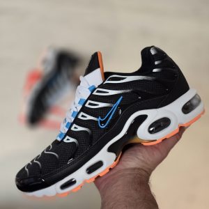 TN NEGRA LOGO AZUL SUELA BLANCA NARANJA