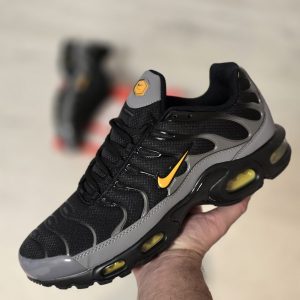 TN NEGRA GRIS LOGO AMARILLO