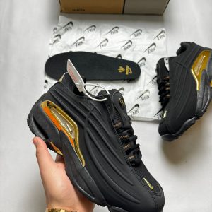 NIKE NOCTA NEGRA DORADA